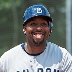 Photo of Cleveland Brownlee in smiling in London baseball uniform and helmut