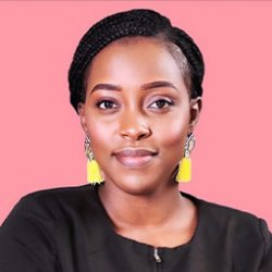 Headshot of Ariella Kayabaga on pink background